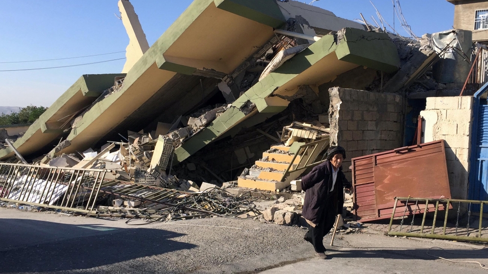 
A man walks past a collapsed building following an earthquake in Darbandikhan in Sulaimaniyah Governorate, Iraq [Ako Rasheed/Reuters] Survivors sit in front of a destroyed house on the earthquake site in Sarpol-e-Zahab in western Iran [Vahid Salemi/AP Photo] Iranian victims of the earthquake mourn around the wreckage of their home in the city of Pole-Zahab, in Kermanshah Province. [Abedin Taherkenareh/EFE/EPA] Iranians walking past the rubble of buildings in Kouik village near to Sarpol-e Zahab. [Atta Kenare/AFP] Survivors sit in front of a destroyed house on the earthquake site in Sarpol-e-Zahab in western Iran [Vahid Salemi/AP Photo] Iranian victims of the earthquake mourn around the wreckage of their home in the city of Pole-Zahab, in Kermanshah Province. [Abedin Taherkenareh/EFE/EPA] Iranians walking past the rubble of buildings in Kouik village near to Sarpol-e Zahab. [Atta Kenare/AFP] Iranian victims of the earthquake mourn around the wreckage of their home in the city of Pole-Zahab, in Kermanshah Province. [Abedin Taherkenareh/EFE/EPA] Iranians walking past the rubble of buildings in Kouik village near to Sarpol-e Zahab. [Atta Kenare/AFP] Iranians walking past the rubble of buildings in Kouik village near to Sarpol-e Zahab. [Atta Kenare/AFP]