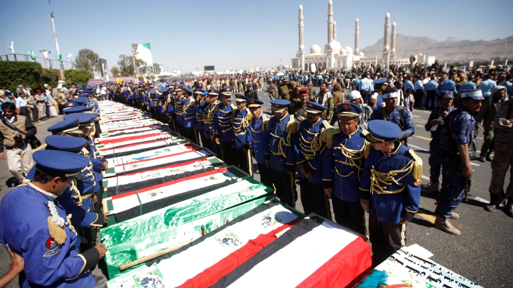 Houthi fighters attend the funeral of their fellow who were killed during the recent clashes in Sanaa
