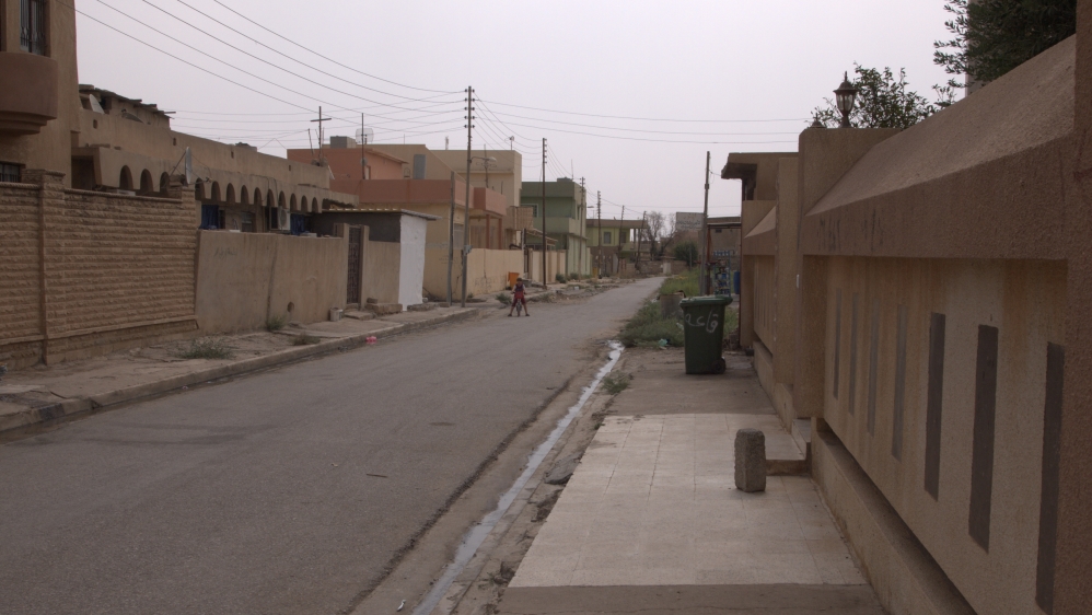 The homes of displaced residents were used variously by ISIL fighters, Kurdish Peshmerga forces and Iraqi paramilitaries [Samira Shackle/Al Jazeera] 
