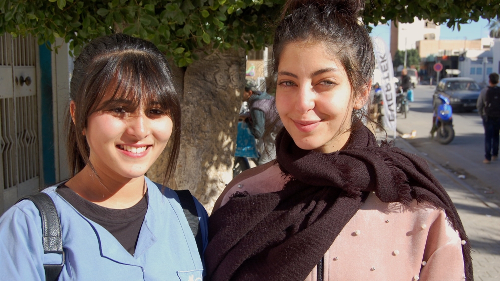 Ardhawi (right) and Tlili say they will emigrate after graduating [Jillian Kestler-D'Amours/Al Jazeera]