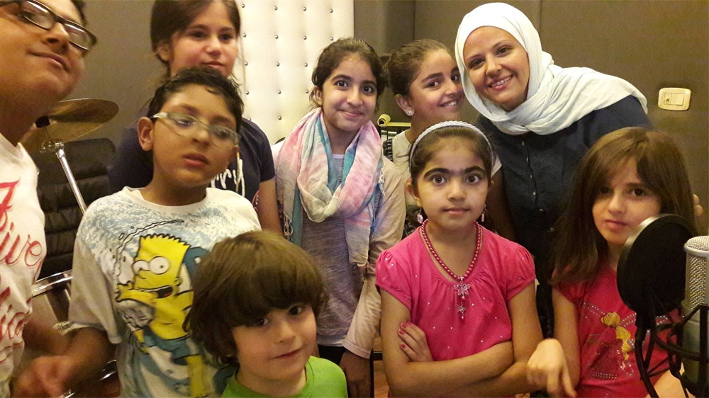 Reem and volunteers recording the cartoon show's theme song in the studio [courtesy of Reem Alfranji]