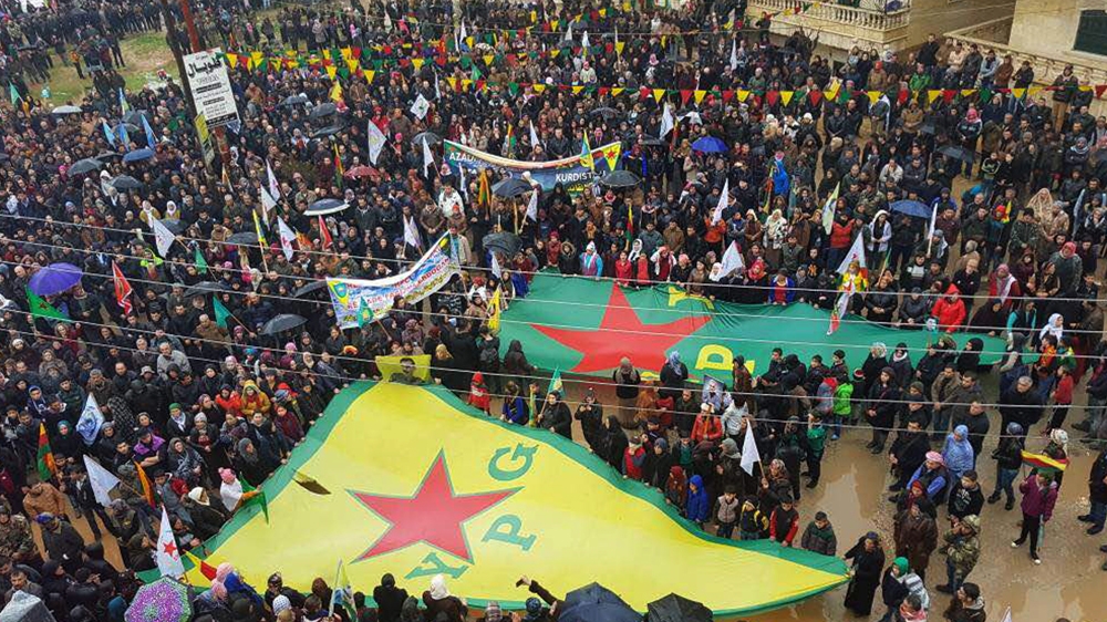 Syrian Kurds rally on Thursday against the Turkish threats in Afrin, Aleppo province [AP]