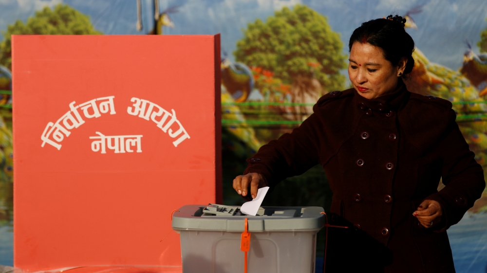 A woman casts her vote during the parliamentary and provincial elections in Bhaktapur