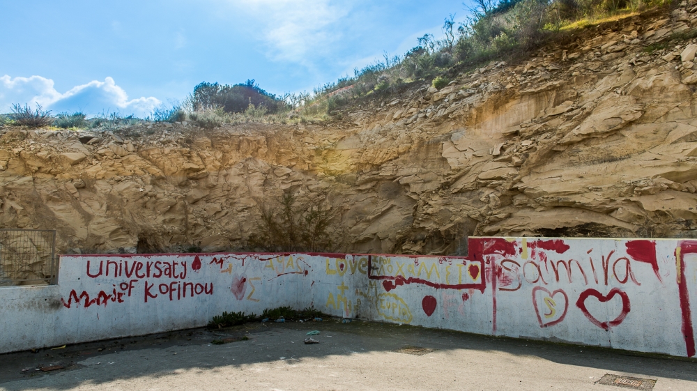 The Kofinou centre lies on a field at the foot of a rocky hill [Dimitris Sideridis/Al Jazeera]