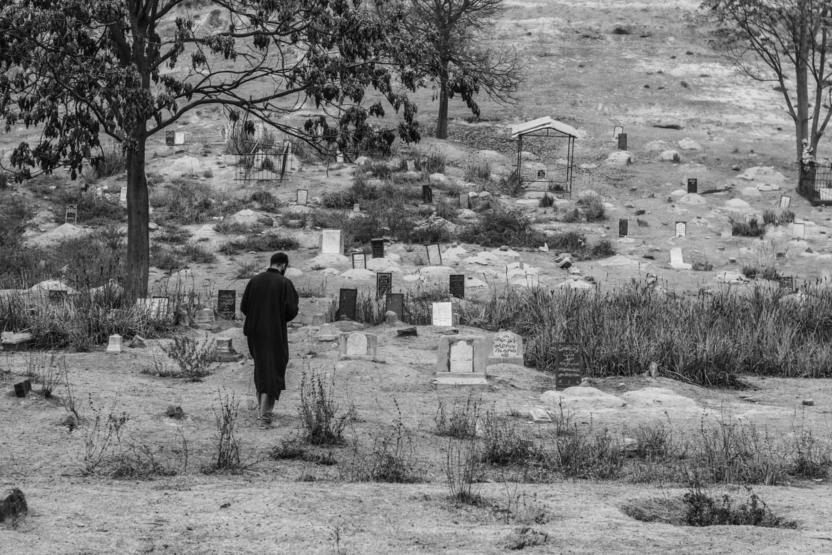 Twenty-two year old Umer Farooq offers prayers at the grave of his father in Bijbehara town, about 44 km south of Srinagar city, the summer capital of Indian-controlled Kashmir. Farooq''s father, a mil