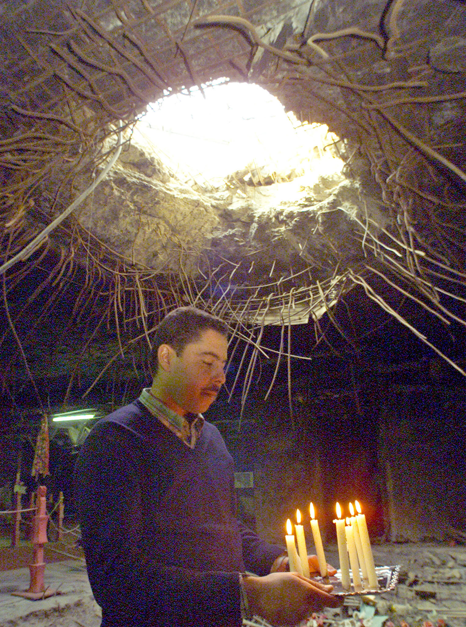 Amir Adnan, a survivor of al-Amiriyya shelter tragedy, celebrates his birthday inside the shelter on January 10, 2001. Adnan's seven-member family was among the more than 400 civilians who were killed inside the shelter [Reuters]