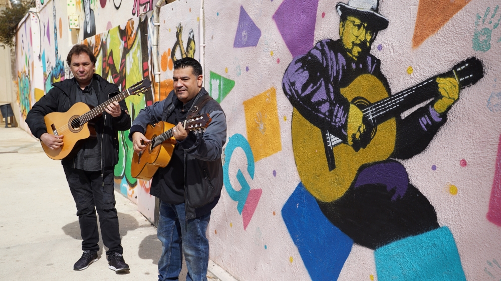 Sicus Carbonell, right, plays Rumba in Gracia [Brietta Hague/Al Jazeera]