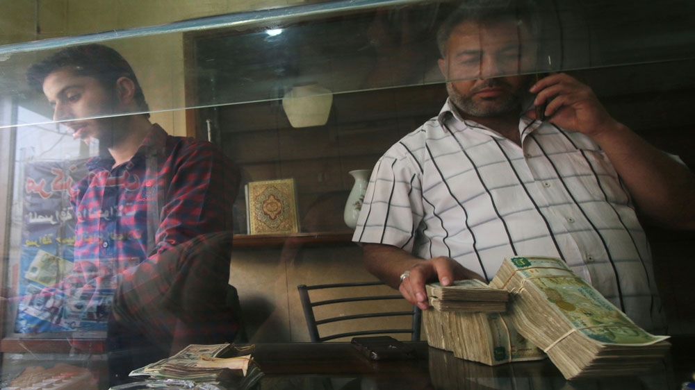 A money exchange vendor Syria