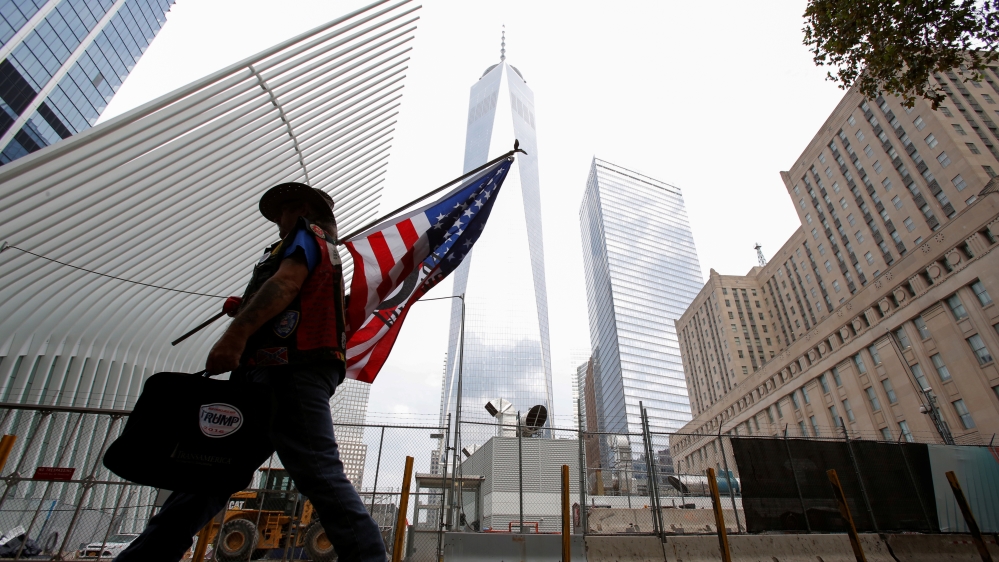 A man arrives at the World Trade Center complex on the morning of the 15th anniversary of the 9/11 attacks in Manhattan, New York