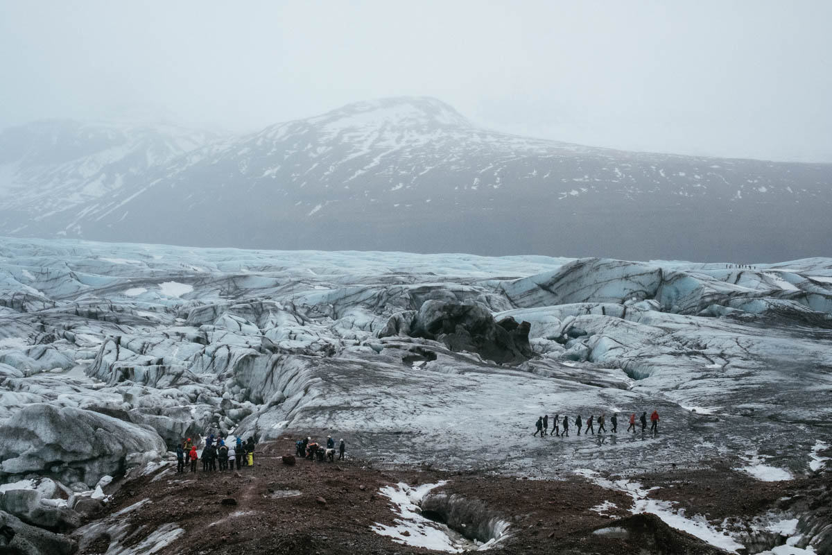 Tourist groups cross a lunar landscape, set in the films Batman Begins, Interstellar, and the famous Game of Thrones series. Local tourism players have decided to focus on filming films and series in