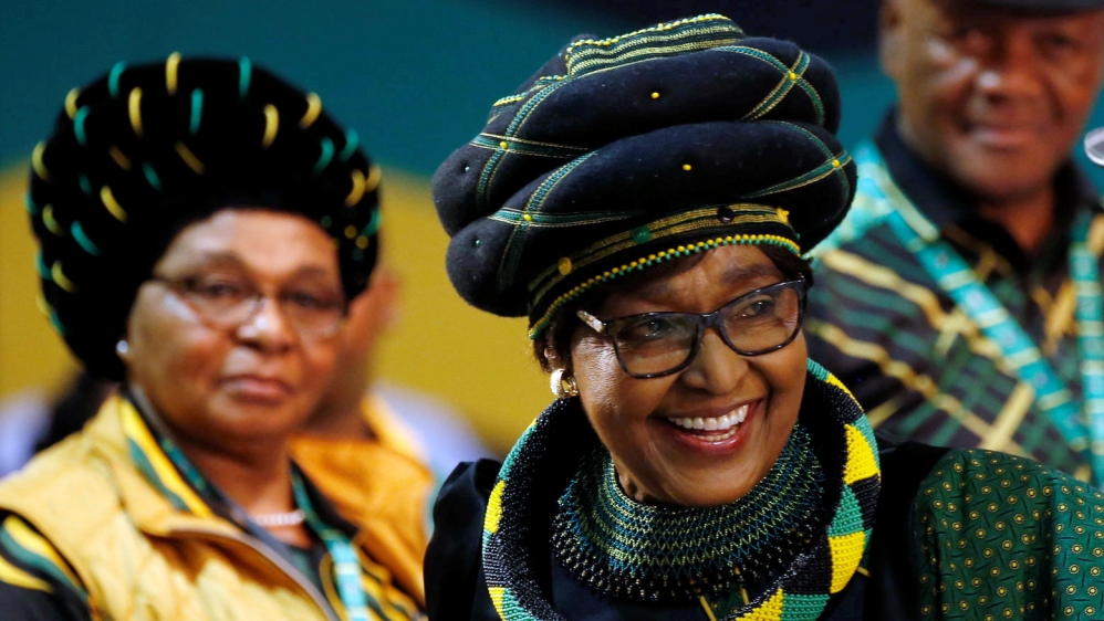 Winnie Madikizela Mandela, ex-wife of former South African president Nelson Mandela, smiles as she arrives for the 54th National Conference of the ruling ANC at the Nasrec Expo Centre in Johannesburg