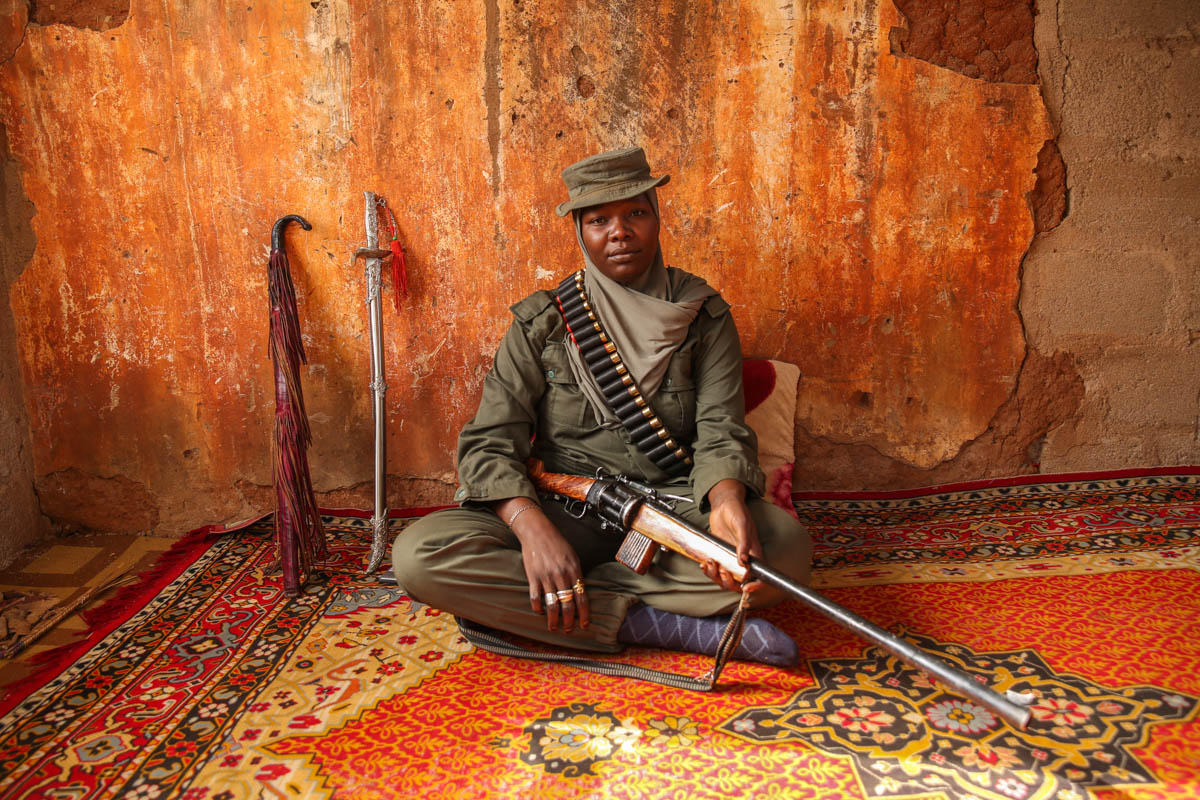 Aisha grew up hunting antelopes and water buffalo with her father. Now she hunts down Boko Haram fighters. Copyright: Rosie Collyer.