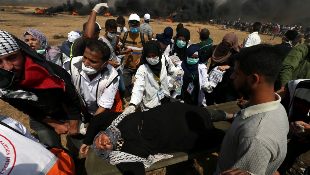
A female demonstrator is evacuated after inhaling tear gas fired by Israeli troops at the Israel-Gaza border [Ibraheem Abu Mustafa/Reuters] Palestinian protesters run from tear gas launched by Israeli forces during the Great March of Return in Khan Younis in the southern Gaza Strip [Mustafa Hassona/Anadolu Agency] Palestinians shout slogans as they protested on Friday [Mustafa Hassona/Anadolu Agency] Palestinian protesters run from tear gas launched by Israeli forces during the Great March of Return in Khan Younis in the southern Gaza Strip [Mustafa Hassona/Anadolu Agency] Palestinians shout slogans as they protested on Friday [Mustafa Hassona/Anadolu Agency] Palestinians shout slogans as they protested on Friday [Mustafa Hassona/Anadolu Agency]
