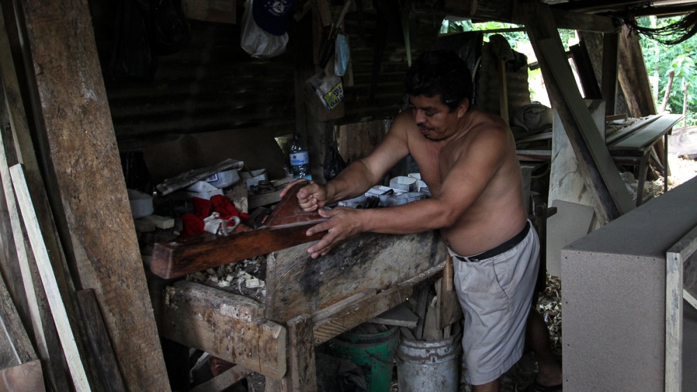 The coffin industry spans the entire supply chain, from carpenters to salespersons [Ali Rae/Al Jazeera]