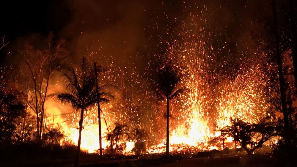 Handout photo of a new fissure spraying lava fountains as high as about 230 feet (70 metres), according to United States Geological Survey, is shown from Luana Street in Leilani Estates subdivision on Kilauea Volcano's lower East Rift Zone in Hawaii [Reuters] 
