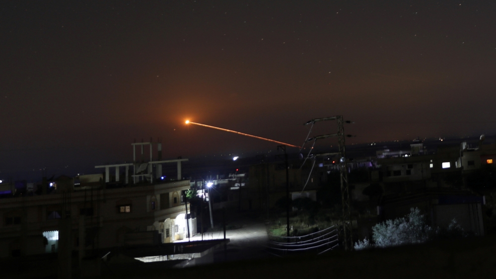 Missile fire is seen over Daraa