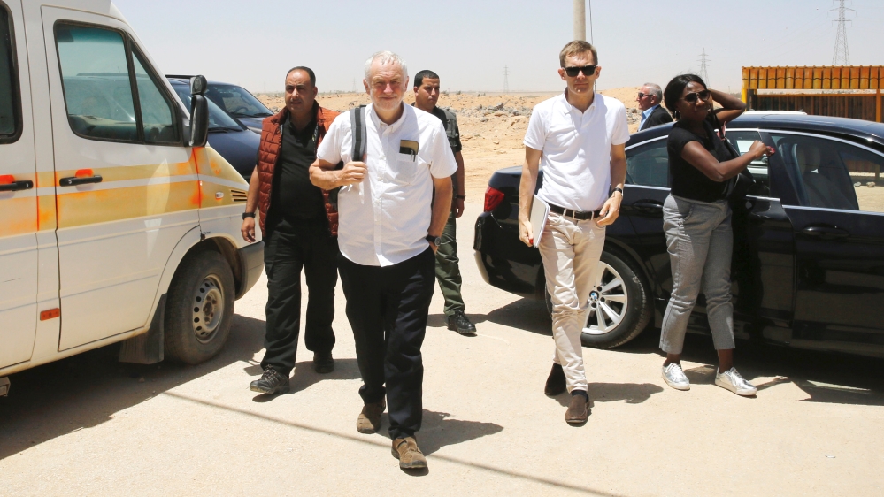 Britain''s opposition leader Jeremy Corbyn walks during his visit to Al Zaatari refugee camp in Mafraq