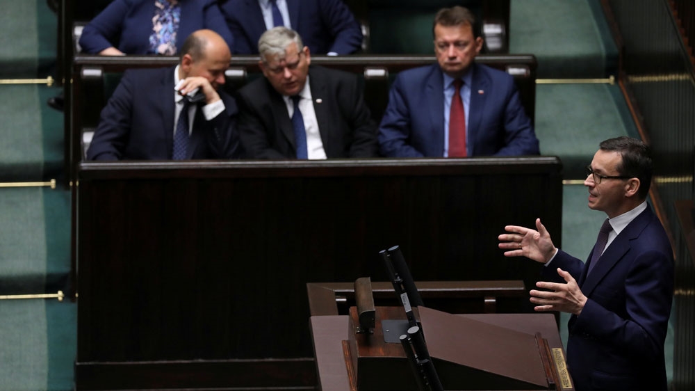 Prime Minister Mateusz Morawiecki is accused by critics of tearing down democratic institutions [Agencja Gazeta/Slawomir Kaminski via Reuters]