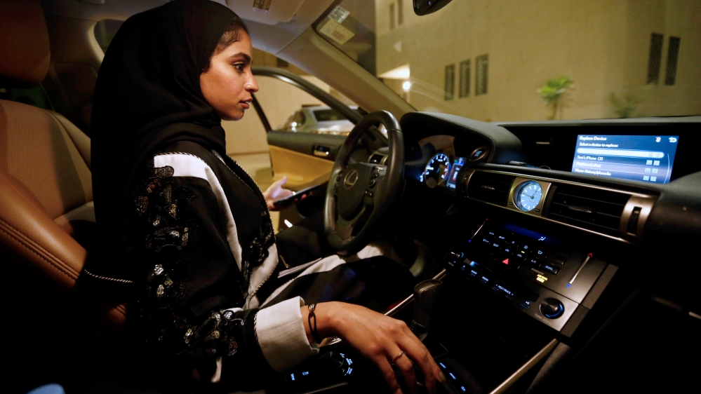Majdooleen, who is among the first Saudi women allowed to drive in Saudi Arabia gets ready before she starts to drive her car in her neighborhood in Riyadh