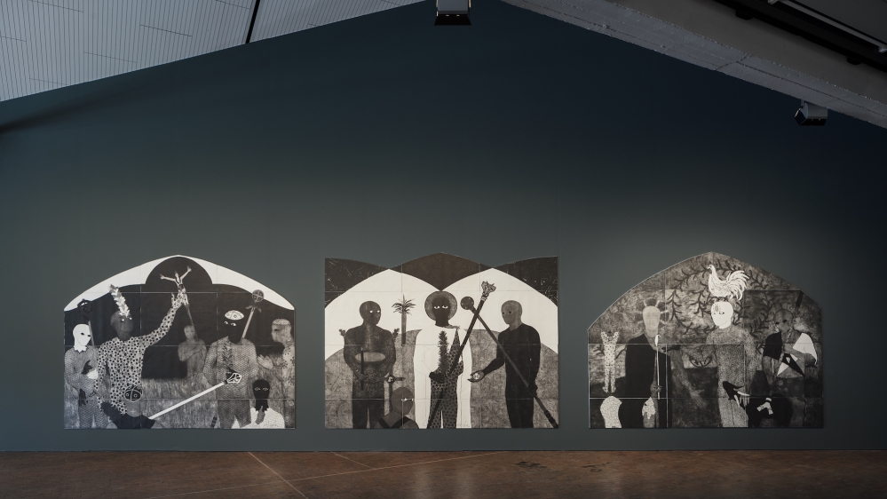 In one of the largest rooms of ADK, La Consagracion I, II, III (1991) - an impressive black, white, and grey-scale triptych of collagraphy works, akin to altar-pieces - and nine other smaller works by Belkis Ayon are on display. [Belkis Ayon, installation view, 10th Berlin Biennale, ADK/ Timo Ohler]
