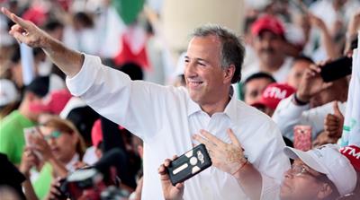 Jose Antonio Meade greets supporters during a campaign rally [File: Alberto Puente/Reuters] 