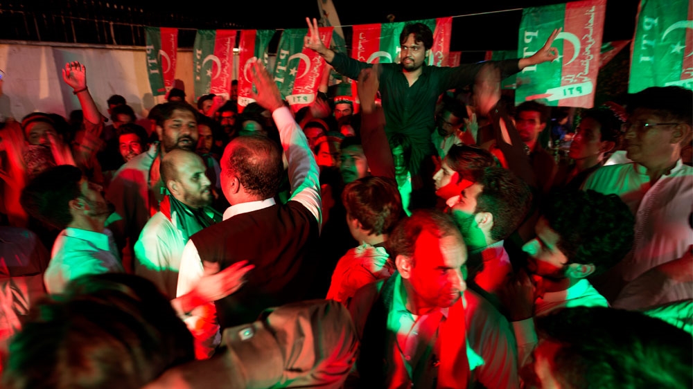 
PTI supporters celebrate projected unofficial results in Islamabad [BK Bangash/AP] 