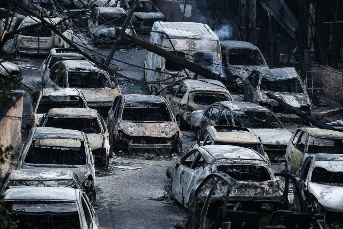 In Mati, many fled their cars and ran for the sea to try to escape the flames. By Tuesday morning, burned-out vehicles lined the coastal village. [Nick Paleologos/SOOC/Al Jazeera]