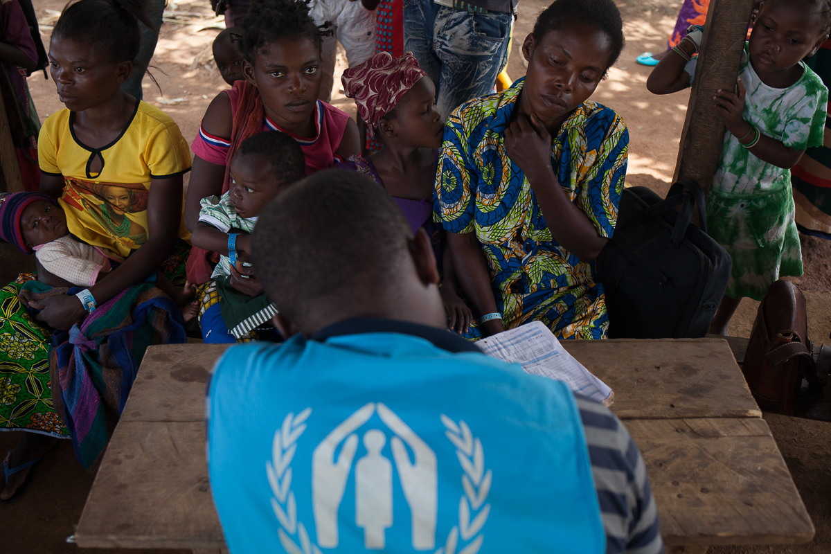 A United Nations High Commission for Refugees (UNHCR) employee takes pieces of information on recently arrived families, prior to the biometric registering that will take place in coming weeks. In Mar