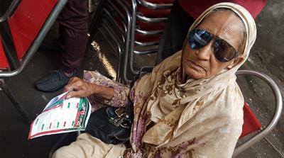 Amna Bibi, PTI voter [Asad Hashim/Al Jazeera] 