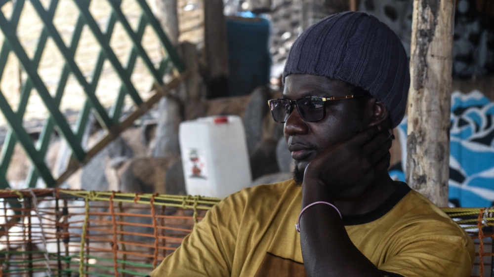 Pape Matar Faye is a professional architect but also the lead guitarist of the Jah Moko Family band. He believes that music can give life skills [Fragkiska Megaloudi/Al Jazeera]