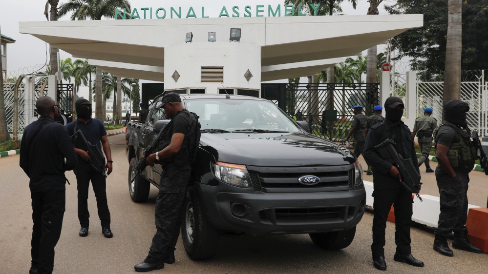 Members of security forces block the entrance of the National Assembly in Abuja