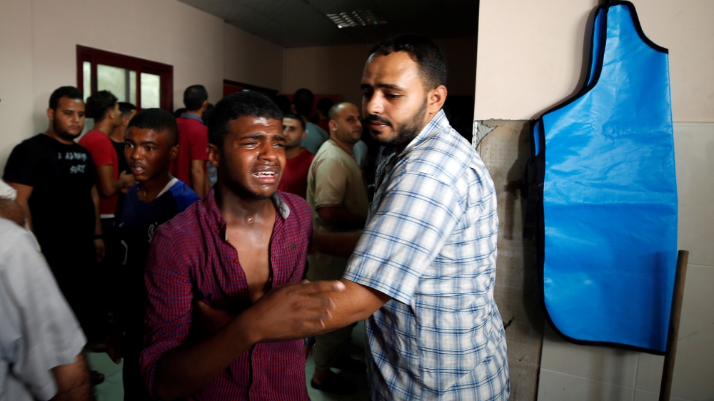 Relative of a Palestinian Hamas militant who was killed in Israeli tank shelling, reacts at a hospital in the northern Gaza Strip