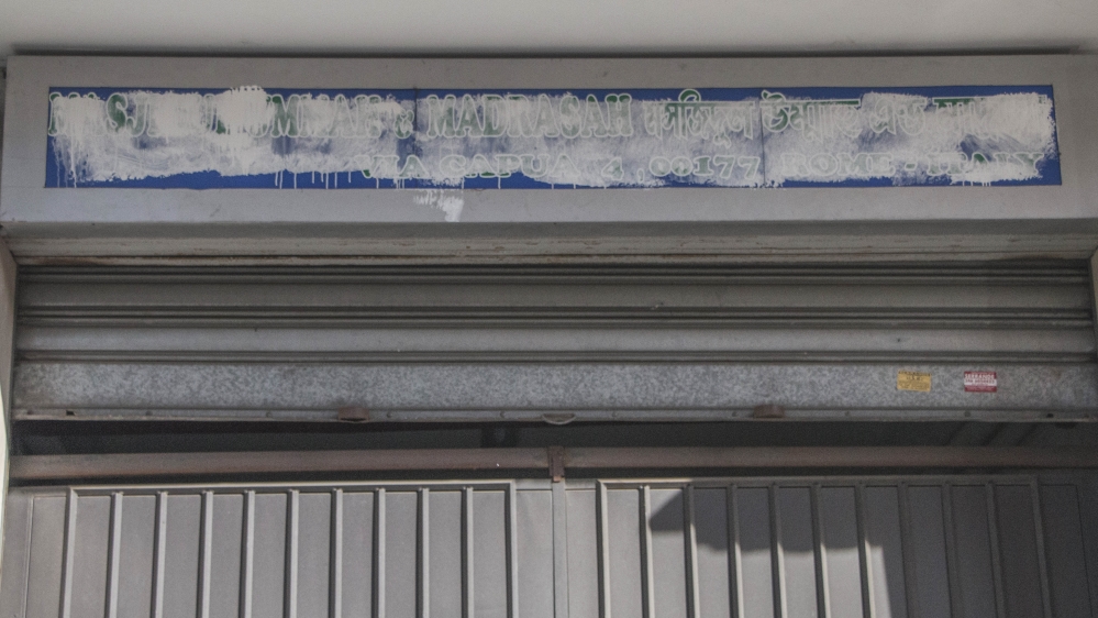 In Torpignattara, home to a large Bangladeshi community, the sign of a local prayer home has been blanked out [Ylenia Gostoli/Al Jazeera]