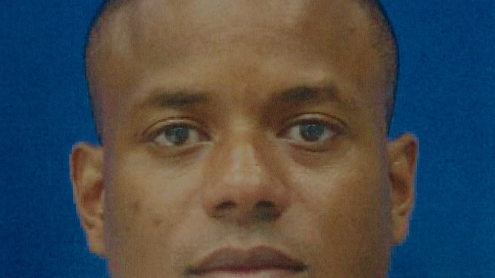 Detective Jemell Rayam pleaded guilty to a conspiracy to rob Baltimore residents dating back to 2009 [Al Jazeera]