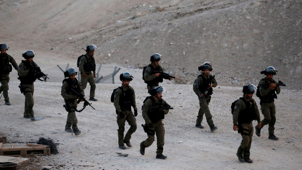 Israeli forces removed shacks close to Khan al-Ahmar village [Mussa Qawasma/Reuters]