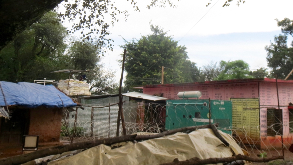 Concertina wire around a school occupied by paramilitary in Kochang village in Khunti, Jharkhand [Anumeha Yadav/ Al Jazeera]