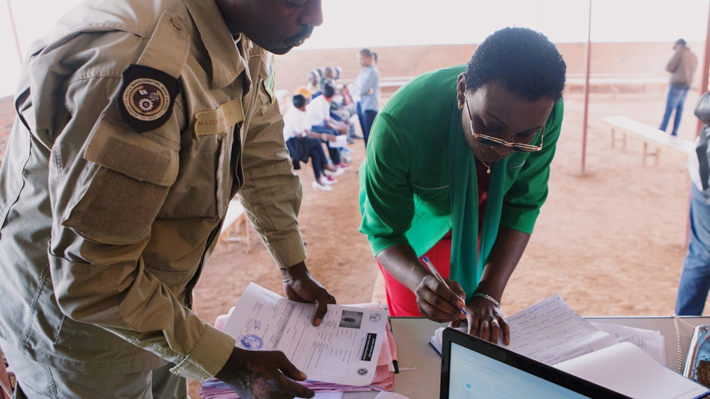 Opposition leader Victoire Ingabire, is cleared before leaving prison [Jean Bizimana/Reuters]