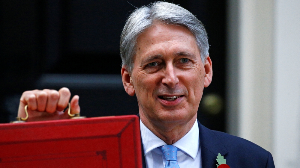 Britain''s Chancellor of the Exchequer Philip Hammond stands outside 11 Downing Street before he delivers his budget statement in the House of Commons in London