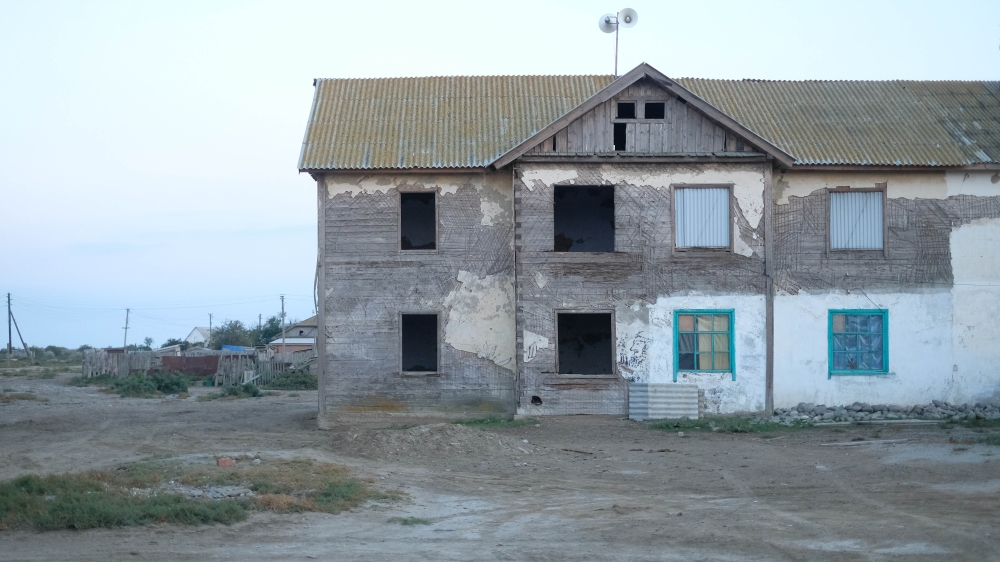 Ruslan Amirov, who lives in this house, says people are 'barely surviving' [Nikolay Korzhov/Al Jazeera]