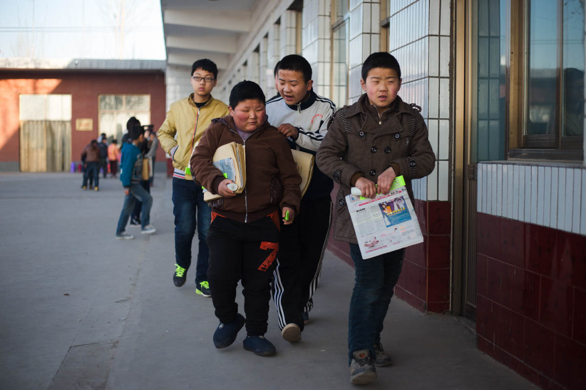 Visually impaired students make their way to the first class of the day. Without this school, many would have little chance of gaining an education in rural China.