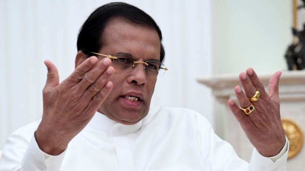FILE PHOTO: Sri Lankan President Sirisena gestures as he speaks during meeting with his Russian counterpart Putin at Kremlin in Moscow