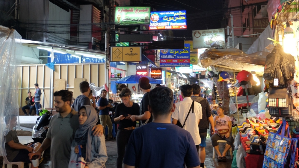 'Soi Arab' in Nana district is popular with Middle Eastern tourists and some refugees have found work there [Kittipot Promprakai/Al Jazeera]