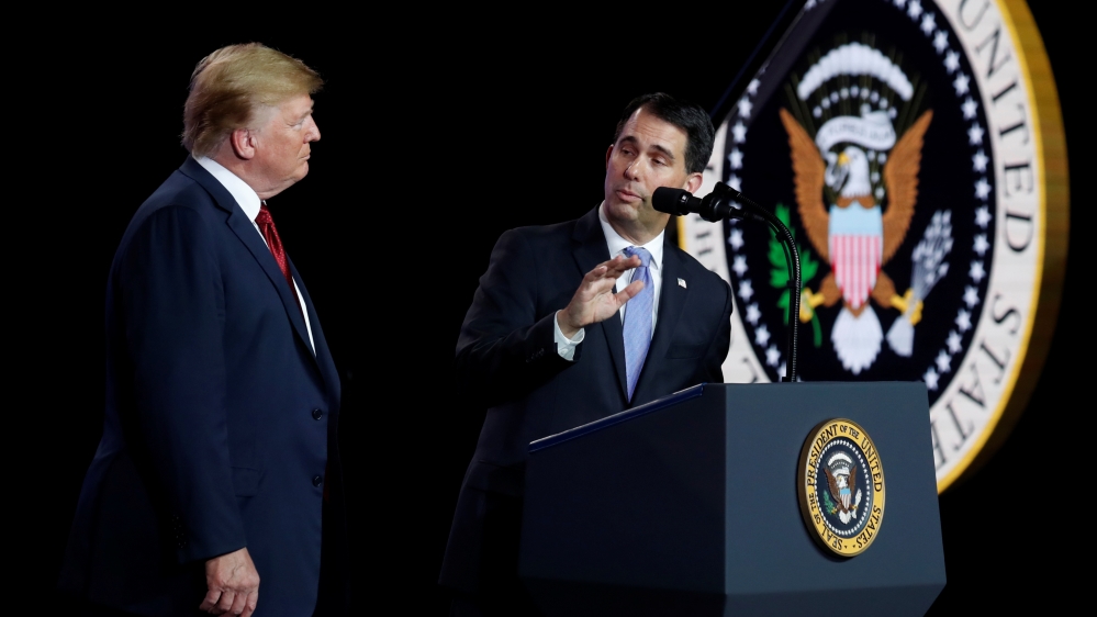 President Donald Trump (left) with Wisconsin Governor Scott Walker [Kevin Lamarque/Reuters]