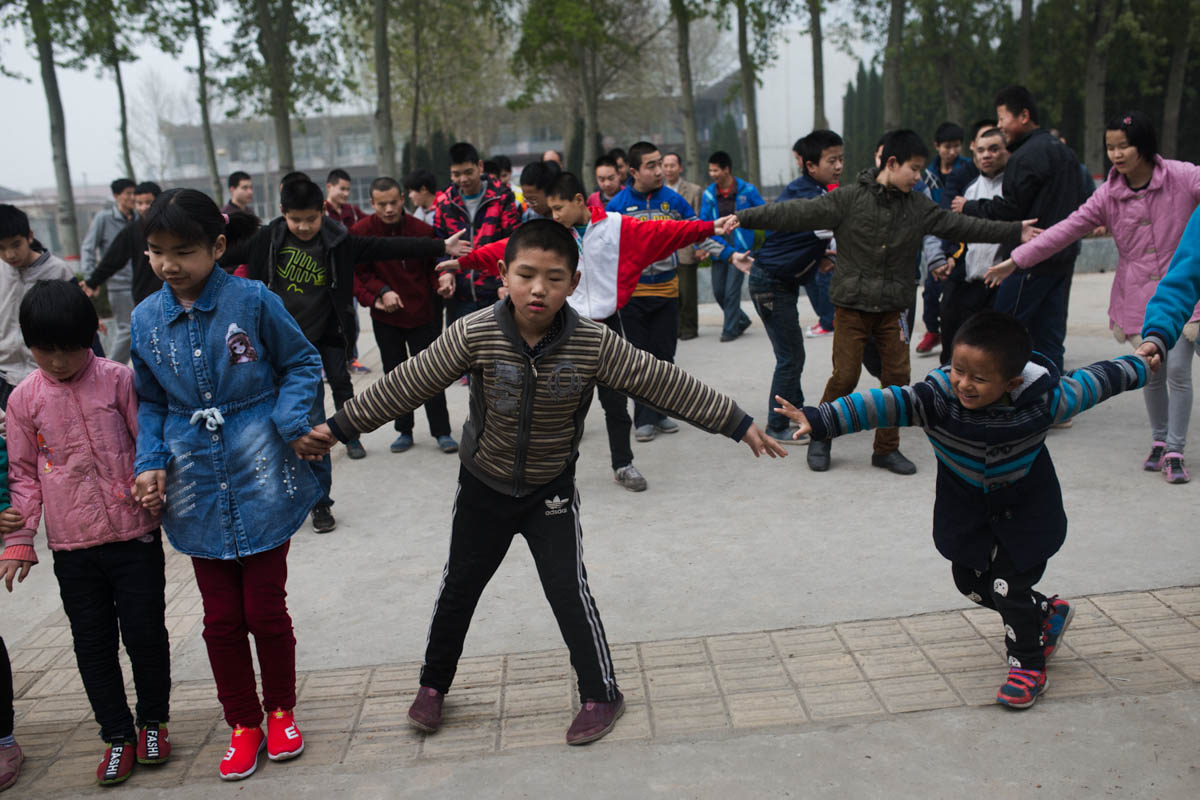 Every morning at 6.30am, the students gather to dance in the playground. 5. Students at Mu Mengjie School for the Blind.