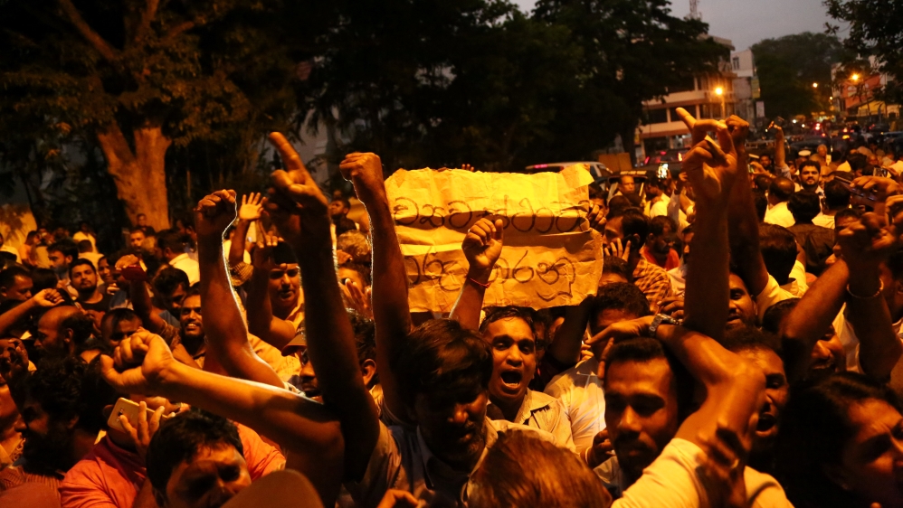 Supporters of Wickremesinghe celebrate outside the Supreme Court premises [Reuters]