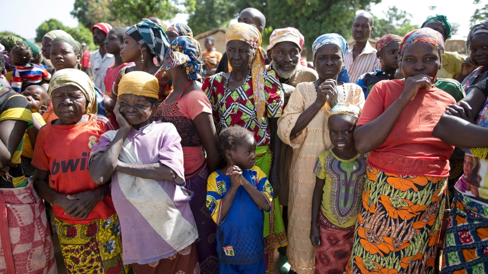 Women stand in line for food aid distribution delivered by the United Nations Office for the Coordination of Humanitarian Affairs and world food program in the village of Makunzi Wali, Central African