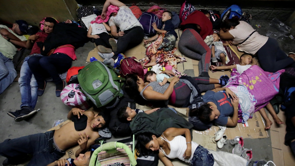 Hondurans fleeing poverty and violence, rest before moving in a caravan toward the United States