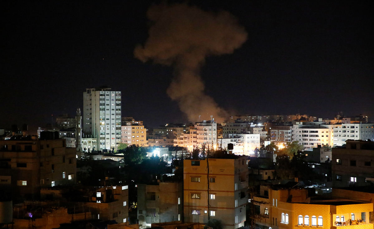 Smoke rises following Israeli strikes on Gaza City, Monday, Nov. 12, 2018. Palestinian militants on Monday fired dozens of rockets and mortar shells into southern Israel, critically wounding an Israel