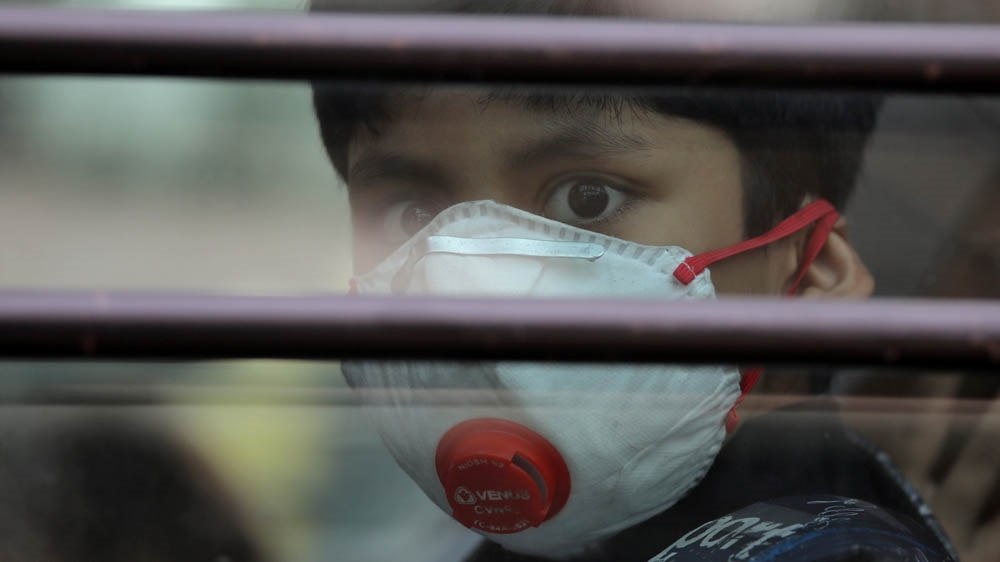 Schoolboy wearing a protective mask