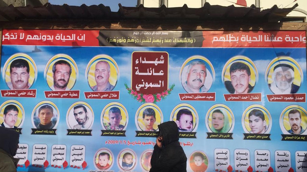 A poster of al-Samouni family members killed by Israeli forces on January 5, 2009, in Gaza [Maram Humaid/Al Jazeera]